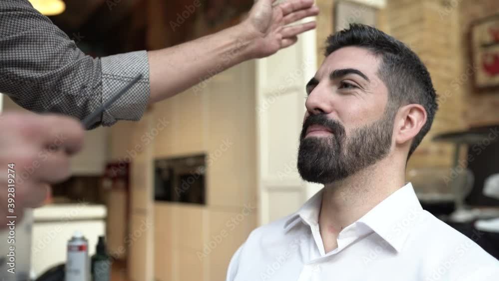 Hairdresser styling hair of groom for wedding Hairdresser styling hair of groom for wedding