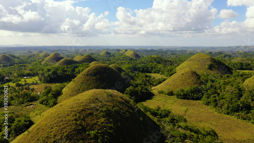 Chocolate Hills - one of the main attractions of the island of Bohol. Summer landscape in the Philippines.