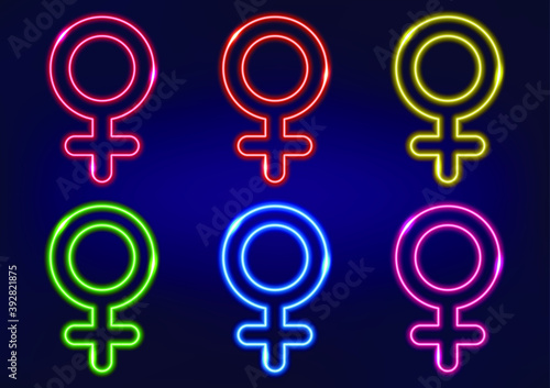 Set of female gender symbols in different colors, neon sign. Venus symbol in neon style. Laser glowing lines on a dark background.