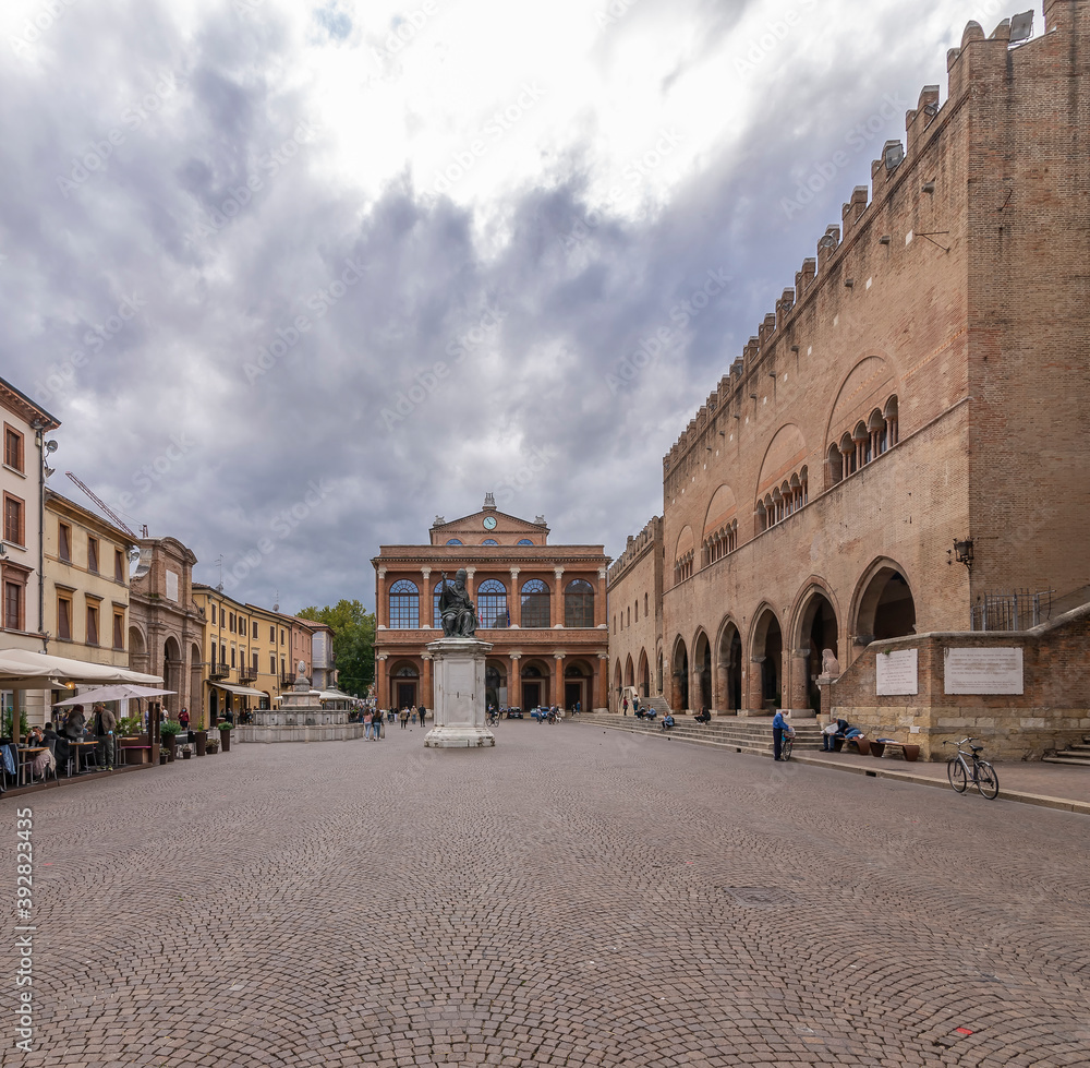 The central Piazza Cavour square, historic center of Rimini, Italy under a dramatic sky