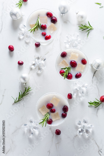 White Christmas margarita punch with cranberries and rosemary