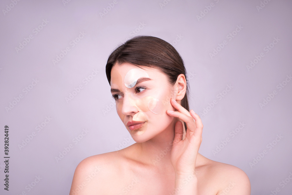 Beautiful caucasia girl with patches. Eye Patches. The concept of skin care. Patches under eyes. Copy space for text. Beautiful caucasia girl with patches. Eye Patches. The concept of skin care. Patches under eyes. Copy space for text.