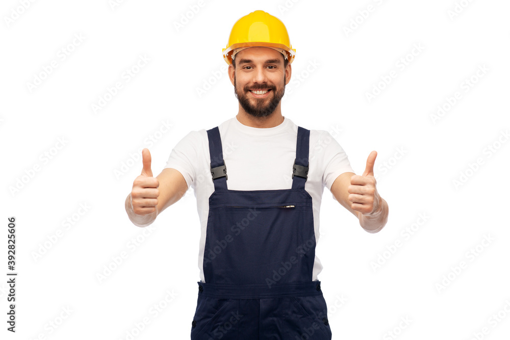 profession, construction and building - happy smiling male worker or builder in yellow helmet and overall showing thumbs up over white background profession, construction and building - happy smiling male worker or builder in yellow helmet and overall showing thumbs up over white background