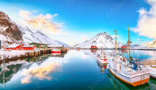 Astonishing winter sunrise over Ramberg village and port.