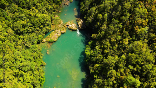 River in the rainforest in a mountain canyon. Loboc River in the green jungle. Bohol, Philippines.
