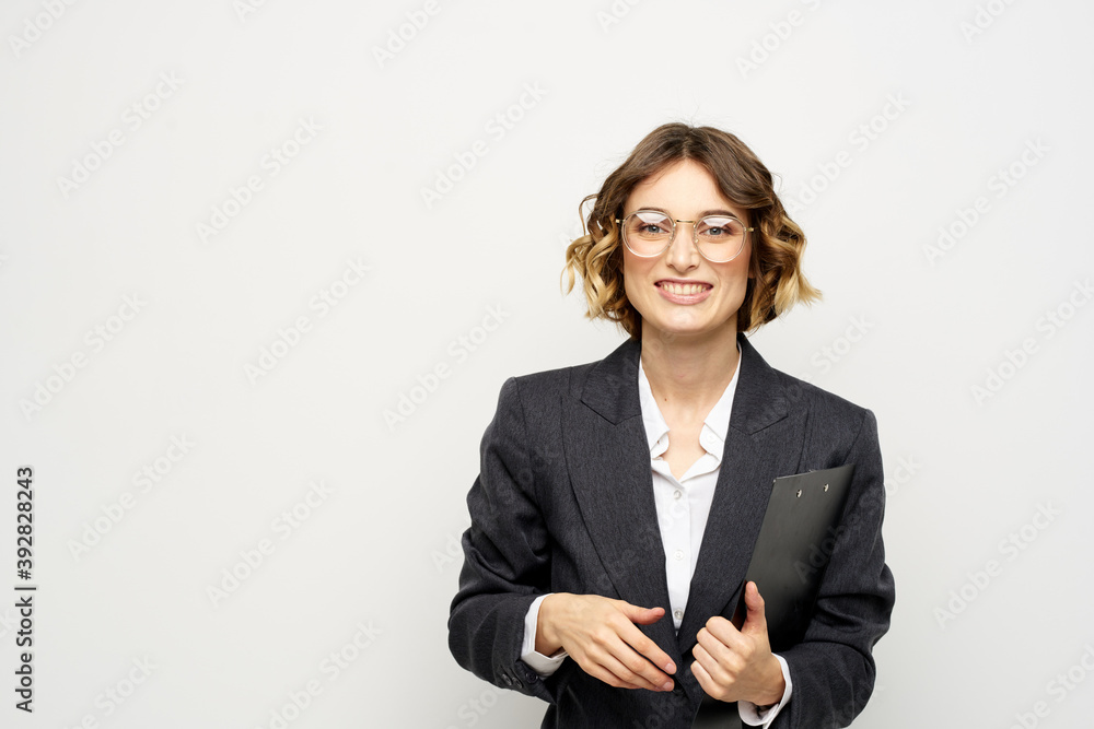 Woman in business suit finances work documents glasses hairstyle Woman in business suit finances work documents glasses hairstyle