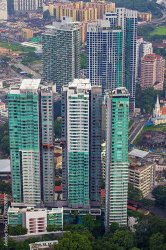 Aerial and elevated view over the modern buildings in cityscape of Kuala Lumpur, capital of Malaysia, Asia. View from the Kuala Lumpur tower (also known as Menara tower) © Blumesser