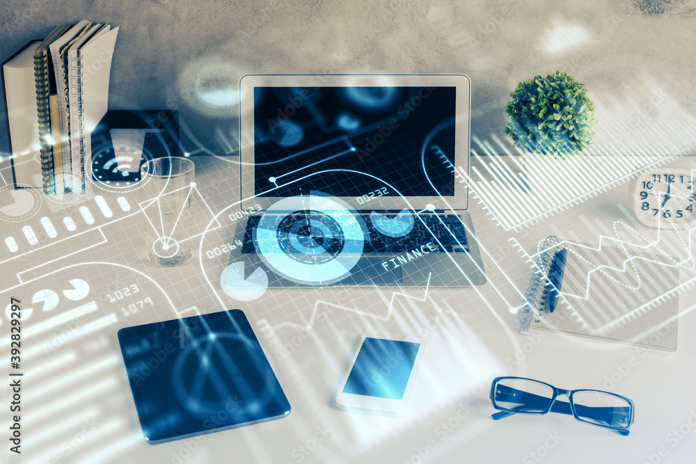 Computer on desktop in office with technology theme hologram. Double exposure. Tech concept. Computer on desktop in office with technology theme hologram. Double exposure. Tech concept.