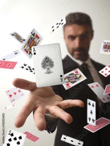 Fotografija Magician making an ace of spades appear from a deck of cards