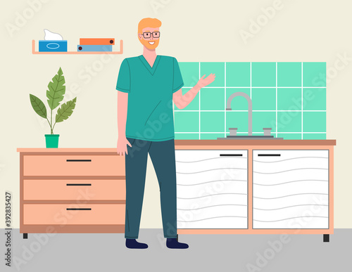 Young blond man doctor or veterinarian wears glasses, uses hospital coat in vet medical office. Table for examination of patients or pets. The interior of doctor s office. Reception at the vet