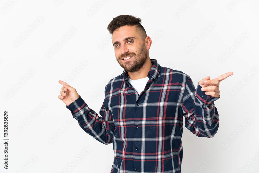Caucasian man isolated on white background pointing finger to the laterals and happy Caucasian man isolated on white background pointing finger to the laterals and happy