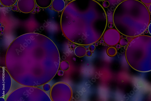 Oil drps in a water .Abstract bubbles on a spotty background. Distortion in water with oil droplets.