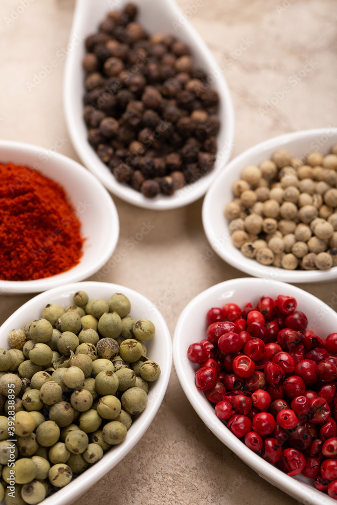 Four Seasons Pepper on beautiful textured background Four Seasons Pepper on beautiful textured background