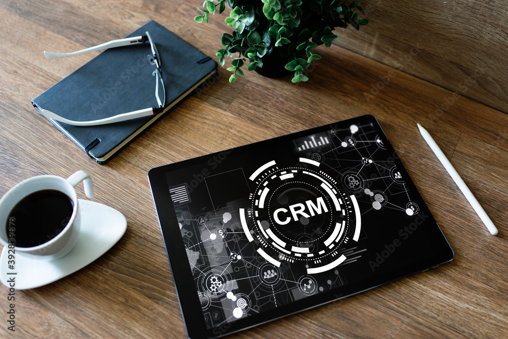 CRM - customer relationship management system concept on screen. CRM - customer relationship management system concept on screen.