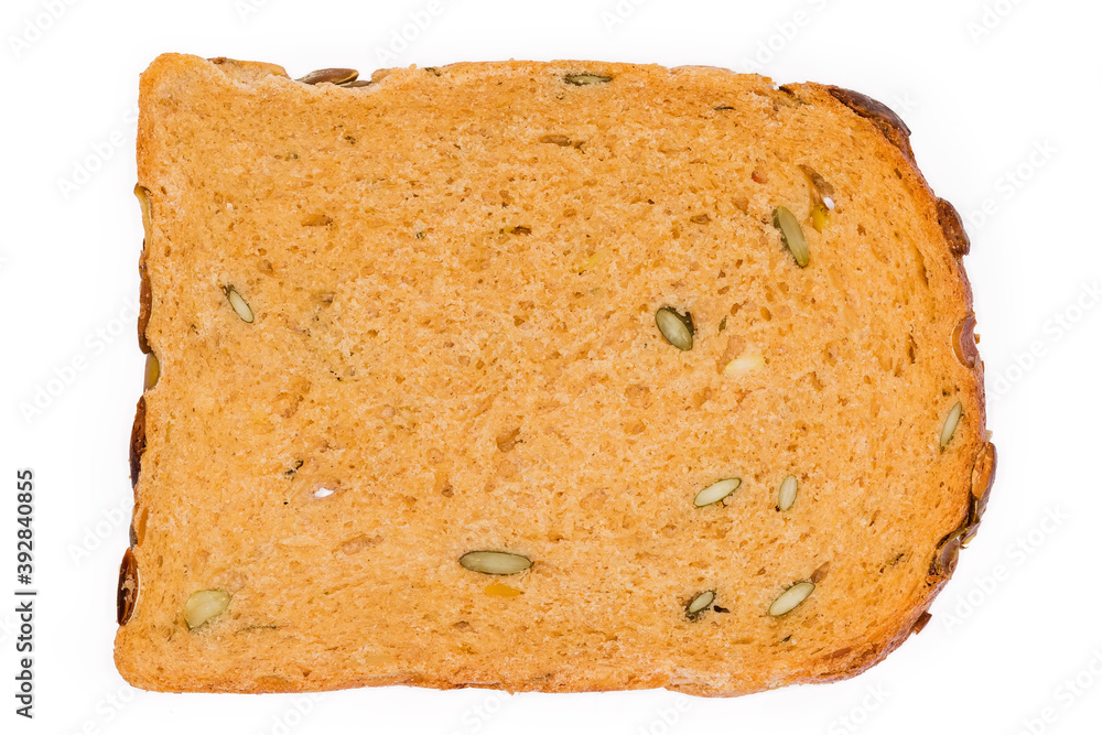 Bread slice with adding pumpkin seeds and juice, top view Bread slice with adding pumpkin seeds and juice, top view