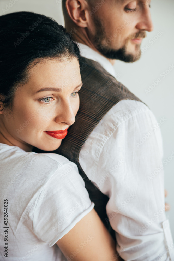 Romantic couple. Family portrait. Harmony love. Sensual smiling woman hugging beloved man back enjoying moments together isolated on white. Romantic couple. Family portrait. Harmony love. Sensual smiling woman hugging beloved man back enjoying moments together isolated on white.