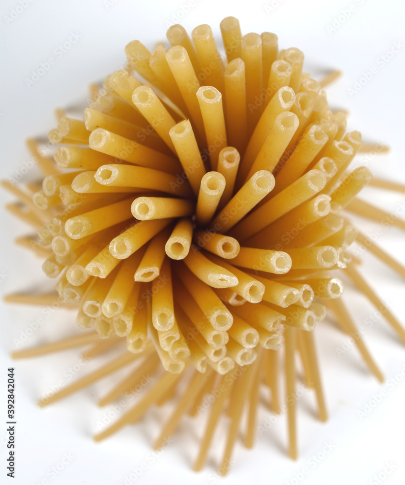 Pasta in the form of tubes form an interesting pattern. a top view. Pasta in the form of tubes form an interesting pattern. a top view.