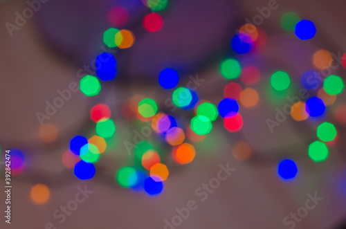 Christmas lights glowing garlands, background and texture of Christmas lights