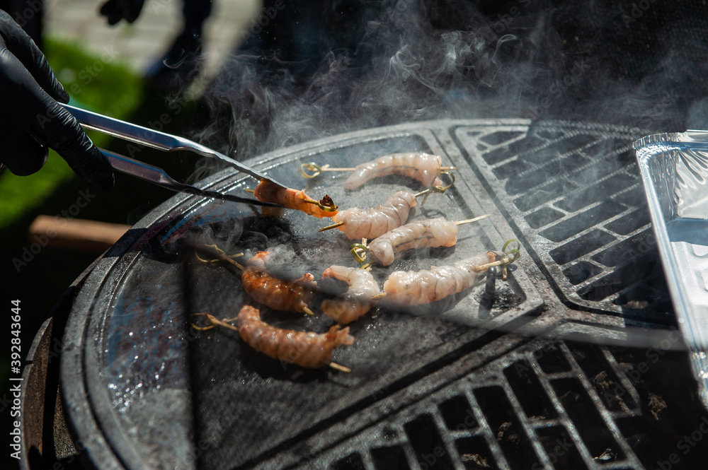 custom made wallpaper toronto digitalA professional cook prepares shrimps on the grill outdoor, food or catering concept