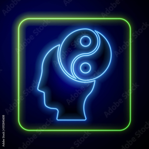 Glowing neon Yin Yang symbol of harmony and balance icon isolated on blue background. Vector.