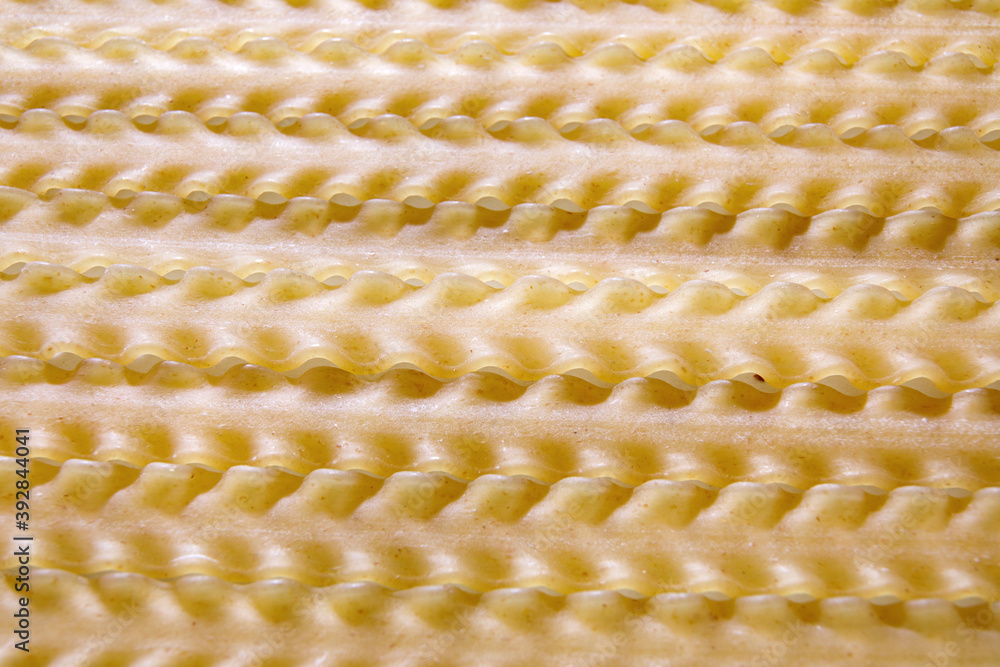 Background of long pasta with a wavy edge. Background of long pasta with a wavy edge.
