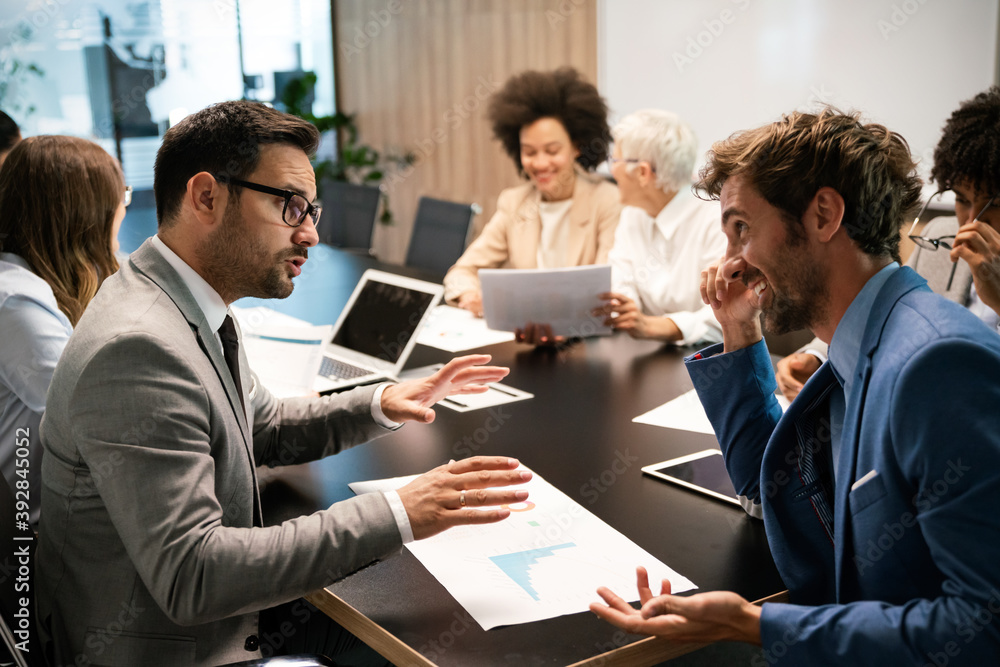 Portrait of successful business team working in office Portrait of successful business team working in office