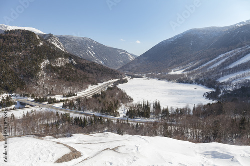 New Hampshire mountains - Cannon and Lafayette, Franconia Notch State Park. Snowy hills and rocks. © yegorov_nick