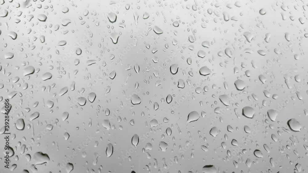 Natural drops of water on the window glass after rain. Water drops on window. Rainy mood concept. Natural drops of water on the window glass after rain. Water drops on window. Rainy mood concept.
