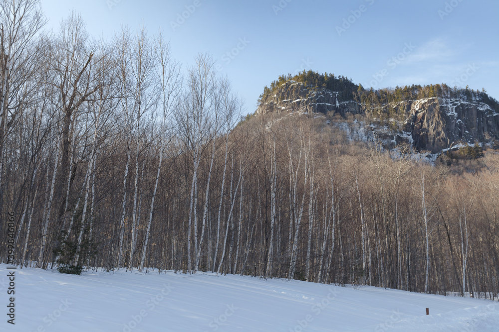New Hampshire mountains - Cannon and Lafayette, Franconia Notch State Park. Snowy hills and rocks. New Hampshire mountains - Cannon and Lafayette, Franconia Notch State Park. Snowy hills and rocks.