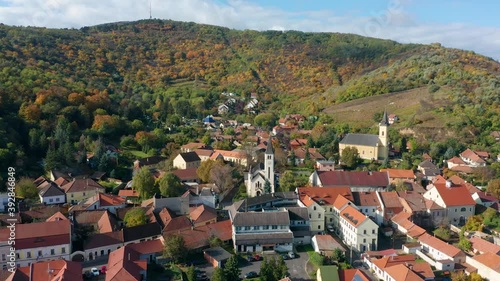 Tokaj, Hungary - 4K drone flying above the town of Tokaj on a warm sunny autumn morning towards the Heart of Jesus Church photo