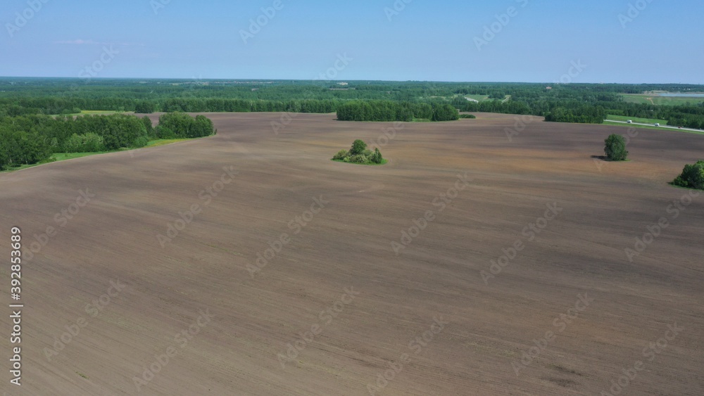 Obraz premium Agricultural fields and reservoirs. Photos taken from a quadrocopter