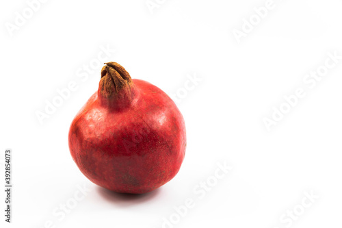 Perfect pomegranate fruit on white isolated background