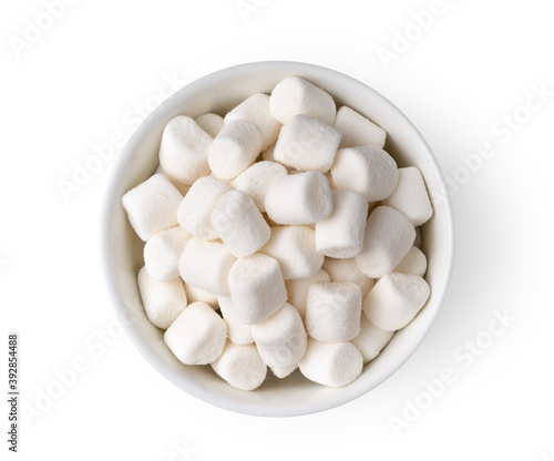 white marshmallows in white bowl isolated on white background