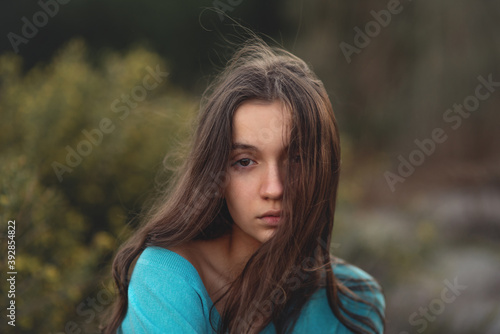 Young girl hair blowing in the wind