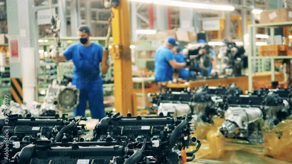 Modern car engines at a car manufacturing facility. Close up Modern car engines at a car manufacturing facility. Close up