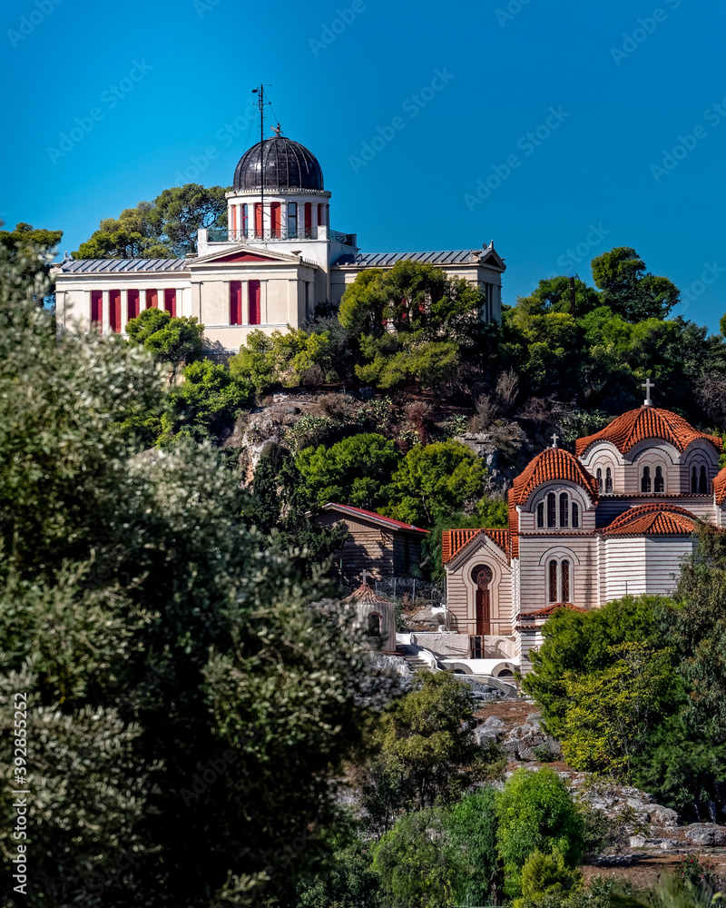 the national observatory of Athens and St. Mary orthodox church on top of the nymphs hill, Greece