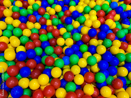 background of blue green red yellow colored spheres into a pool of balls