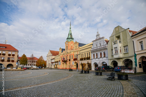Baroque town hall with clock tower at main Peace square of historic medieval royal town Melnik, colorful renaissance houses in sunny autumn day, Central Bohemia, Czech republic