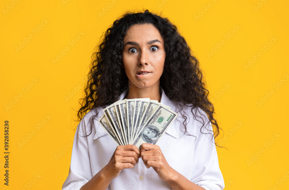 Big Win. Crazy Brunette Lady Holding Bunch Of Dollar Banknotes In Hands Big Win. Crazy Brunette Lady Holding Bunch Of Dollar Banknotes In Hands