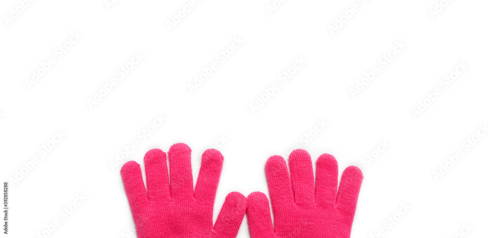 Obraz premium pink baby winter gloves on a white background. isolated.