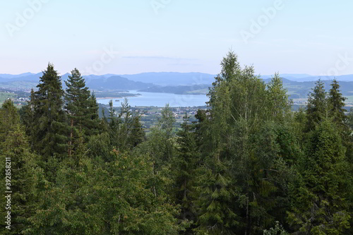 Panorama with green forest and mountains and blue sky with clouds in summer in southern Poland in Europe