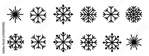 Set of black snowflakes set on white background. Vector flat illustration.