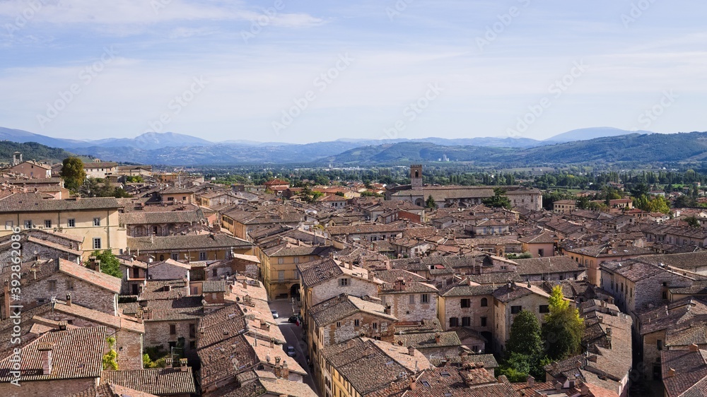 Panoramic view from above of the medieval Italian village of Gubbio with old buildings (Umbria, Italy, Europe)