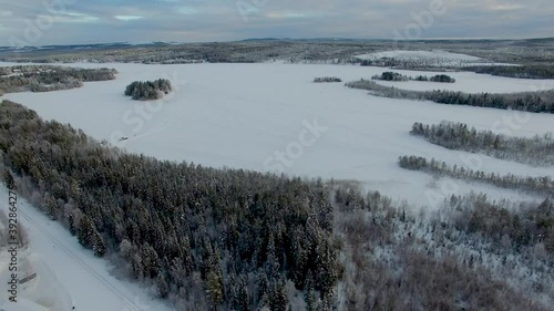 Drone shot over frozen lake in northern parts of sweden photo