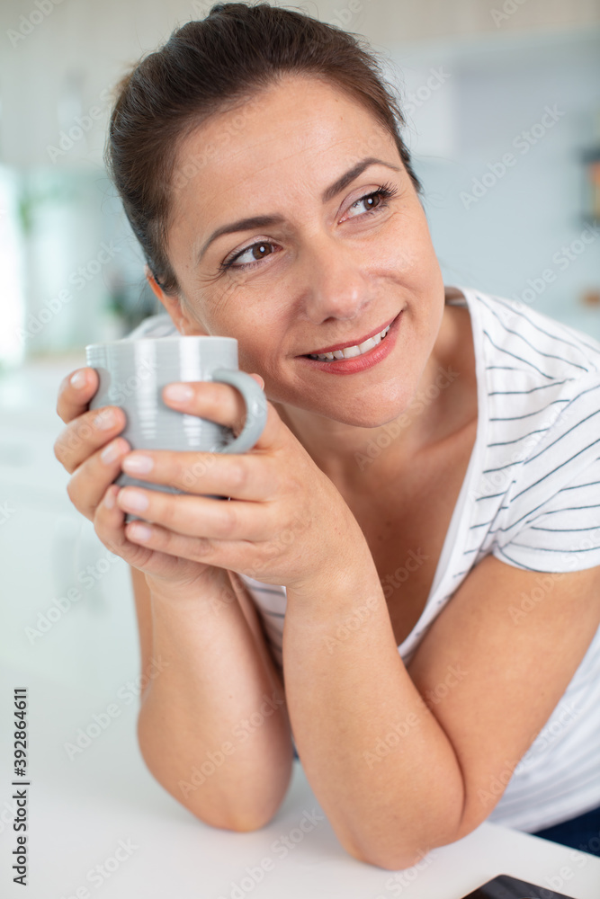 portrait of an attractive brunette with a mug portrait of an attractive brunette with a mug