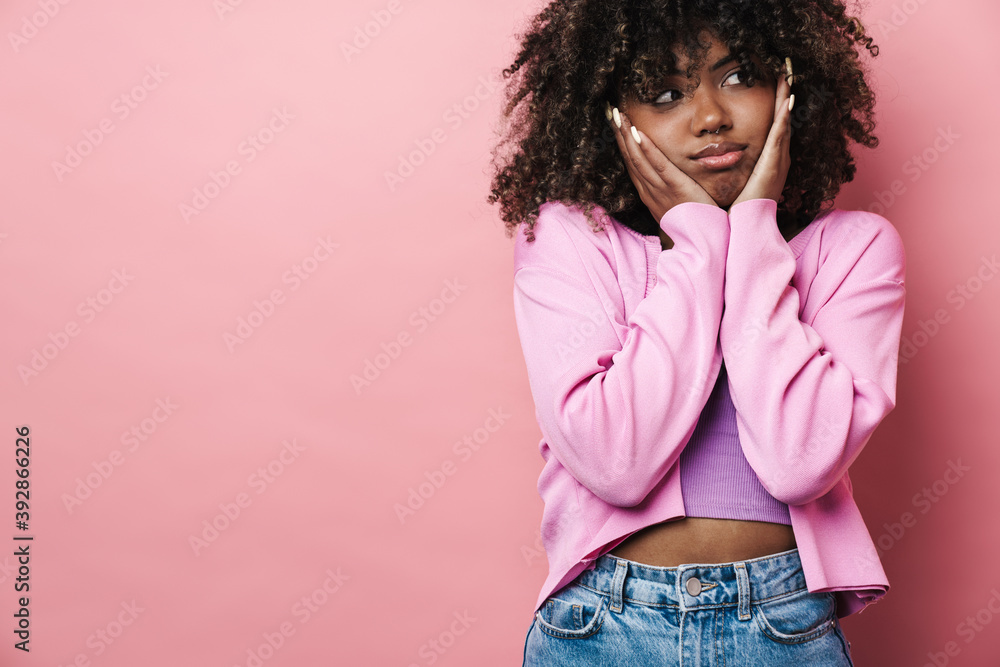 Unhappy african american woman posing and looking aside Unhappy african american woman posing and looking aside