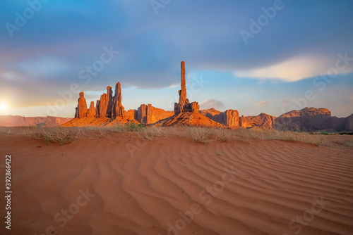 Totem pole and sand dunes in Monument Valley, Arizona USA