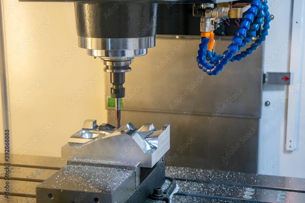 The CNC milling machine cutting the mold parts by solid ball end-mill tool. The hi-precision mold and die manufacturing concept by machining center. The CNC milling machine cutting the mold parts by solid ball end-mill tool. The hi-precision mold and die manufacturing concept by machining center.