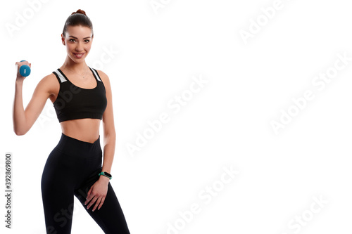 Fototapeta Naklejka Na Ścianę i Meble -  Smiling attractive caucasian slim woman doing physical exercise using dumbbell isolated on white background