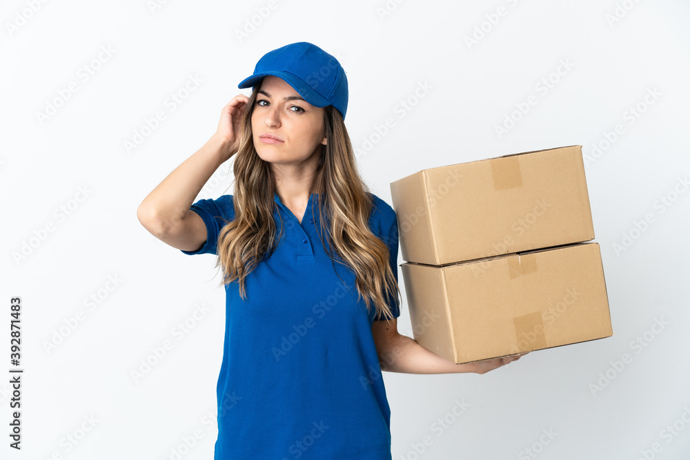 Young Romanian delivery woman isolates on white background having doubts Young Romanian delivery woman isolates on white background having doubts